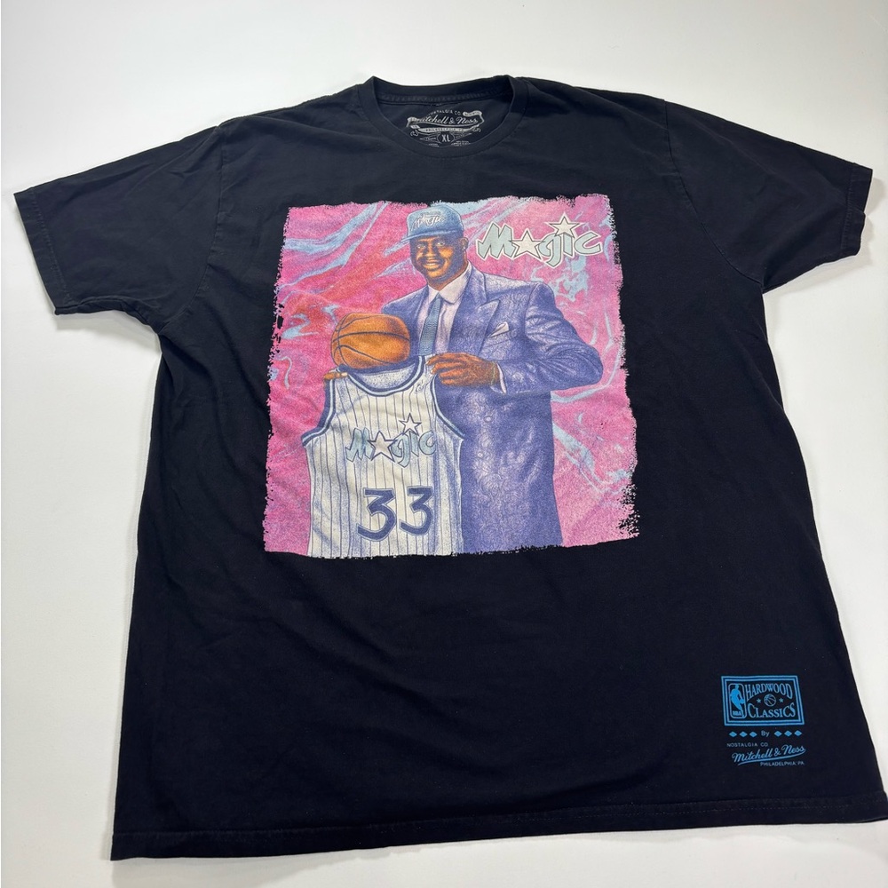 Mitchell & Ness Black Orlando Magic Shaq Graphic Tee with Pink/Purple Art